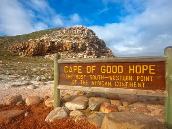 Cape of Good Hope sign beside a rocky coastal landscape
